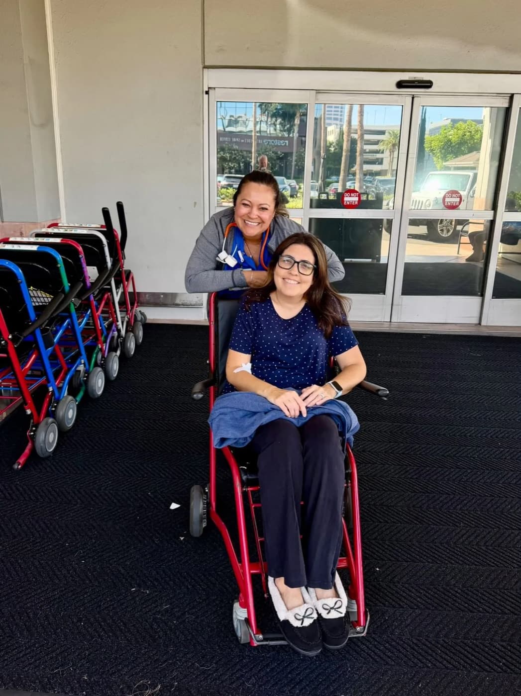 Michaela smiling with her nurse